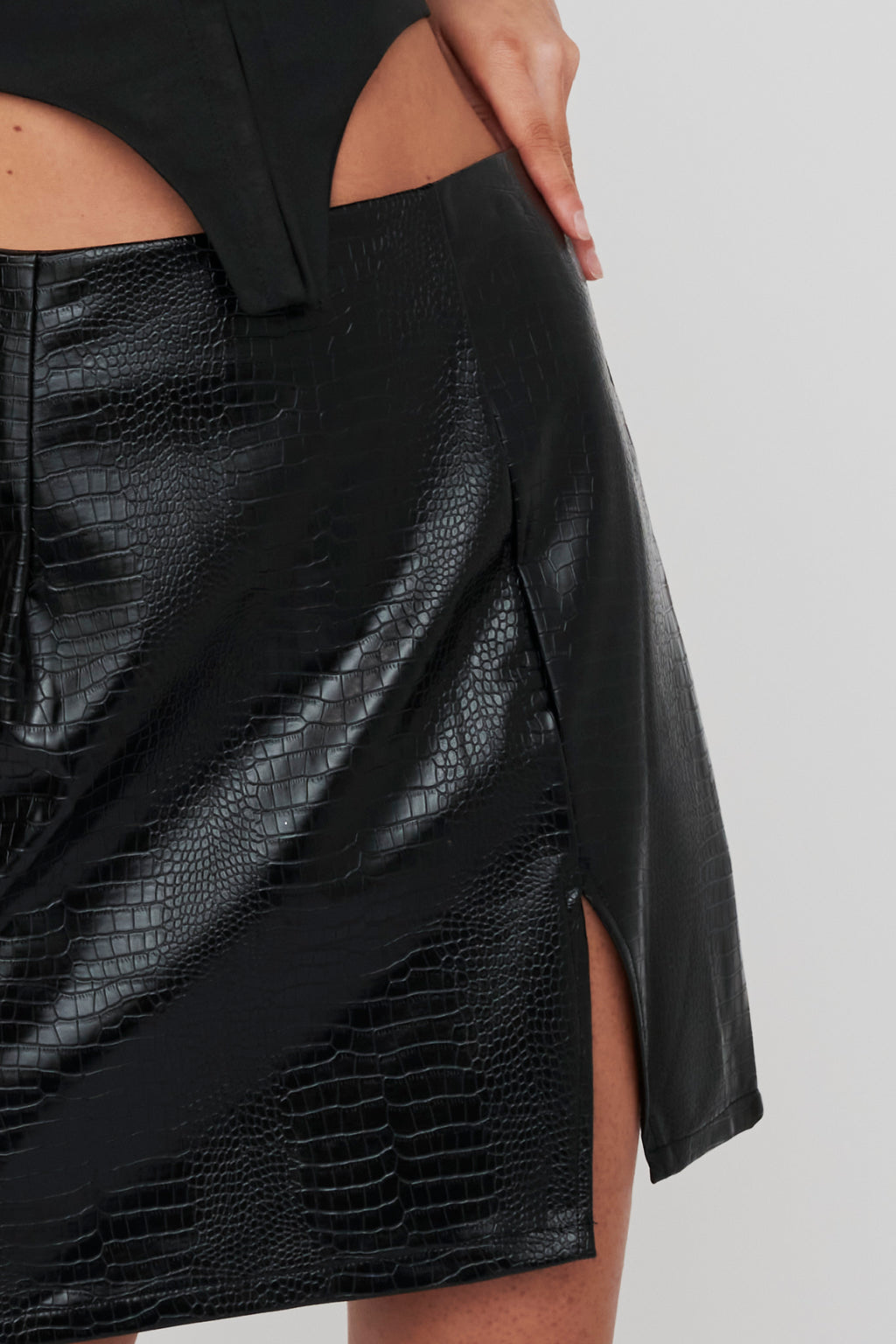 Darwin Embossed Mini Skirt Black by Selfie Leslie