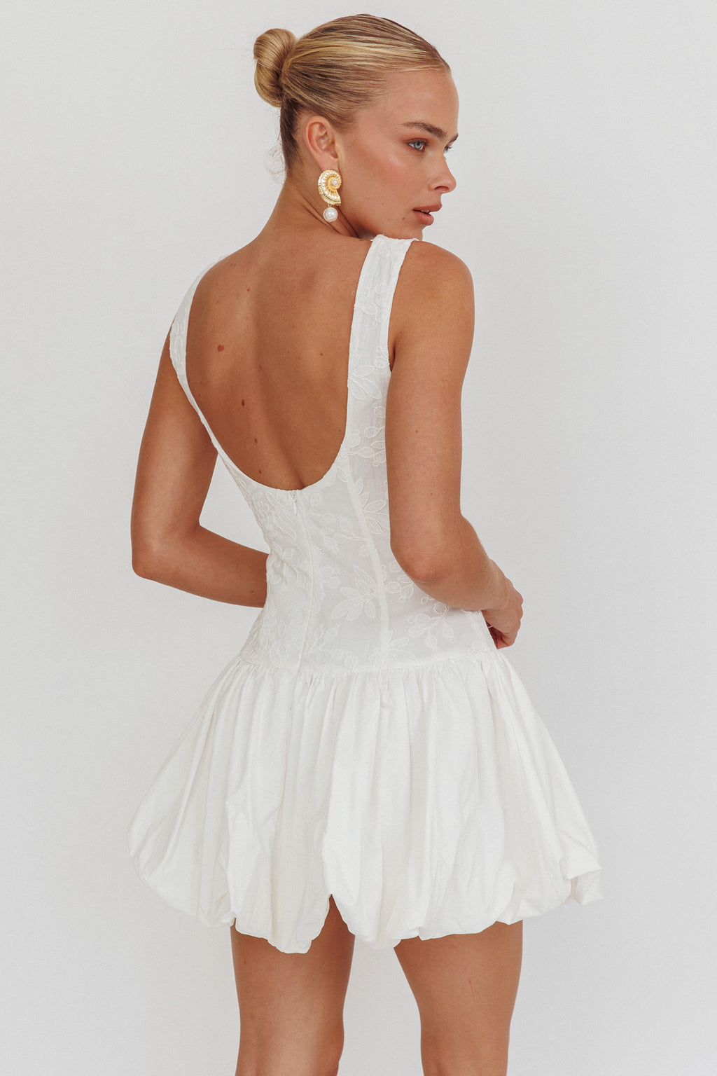 Opulent Sleeveless Bubble Hem Mini Dress Embroidered White by Selfie Leslie