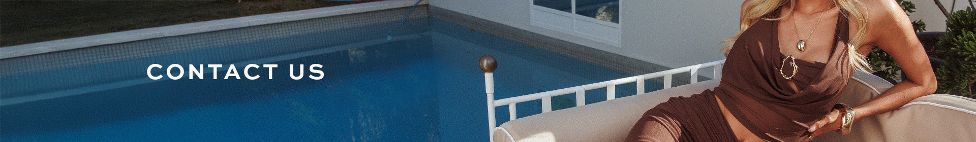 Woman sitting by a pool with 'Contact Us' text overlay