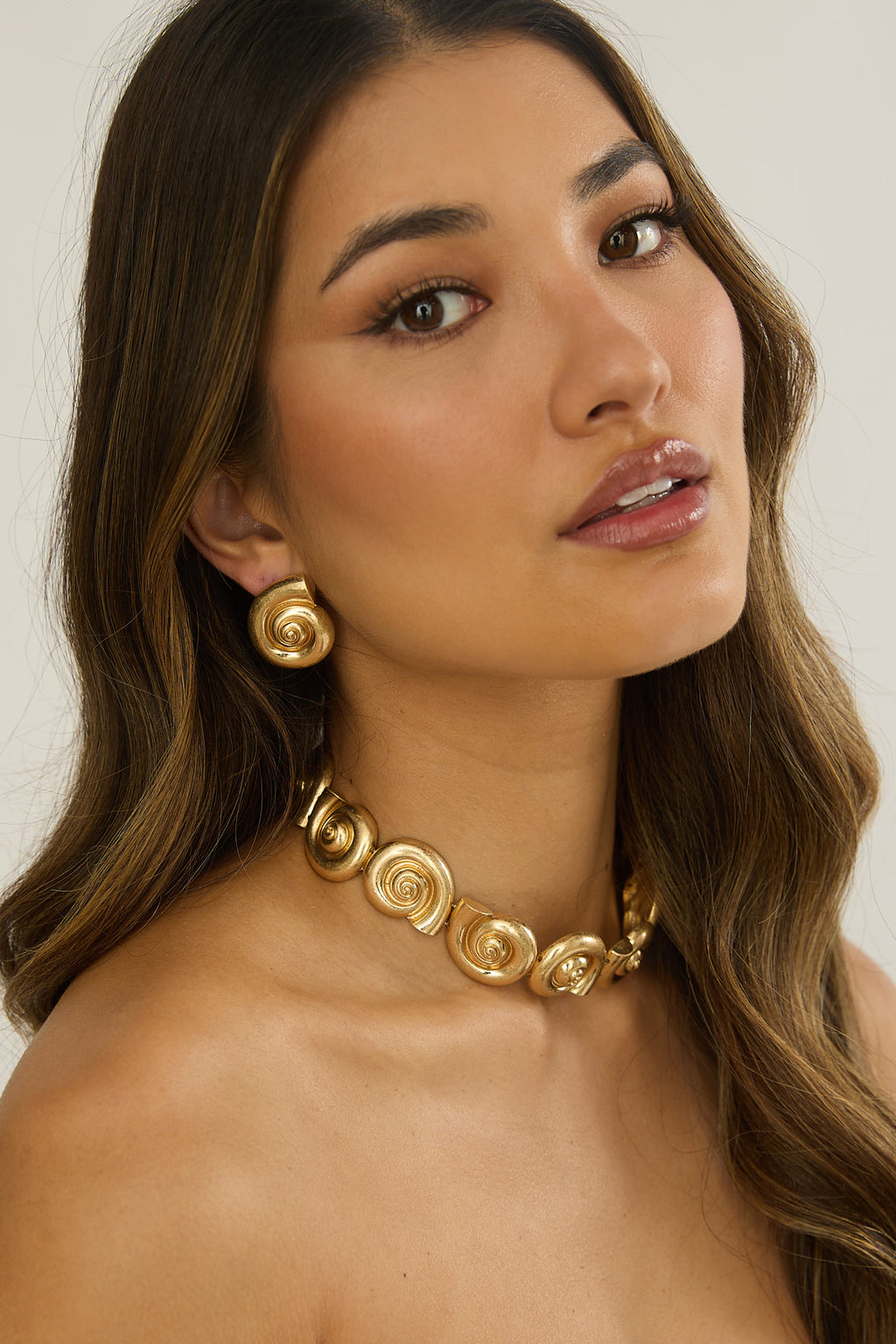 Noxelle Spiral Shell Earrings Gold by Selfie Leslie
