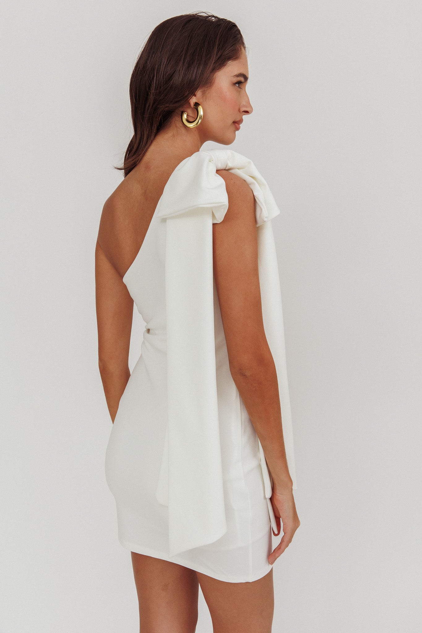 Earned It One Shoulder Bow Mini Dress Ivory by Selfie Leslie