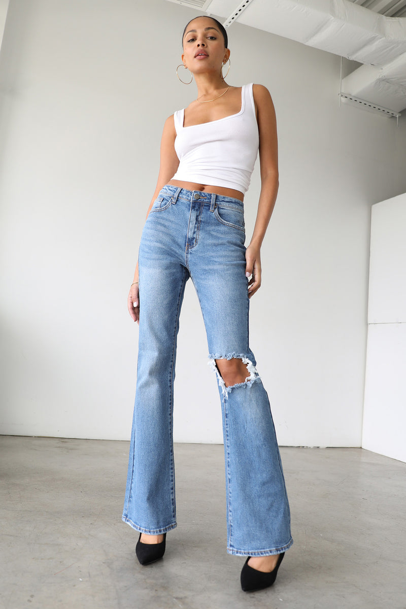 Shop the DOGMA High Rise Flare Leg Denim Jeans Medium Wash