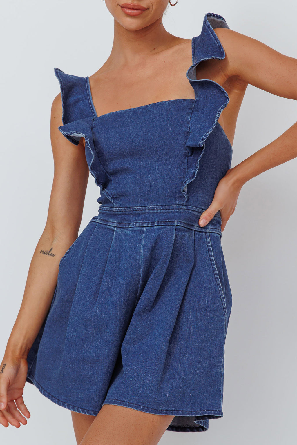 Nola Flared Ruffle Romper Light Denim by Selfie Leslie