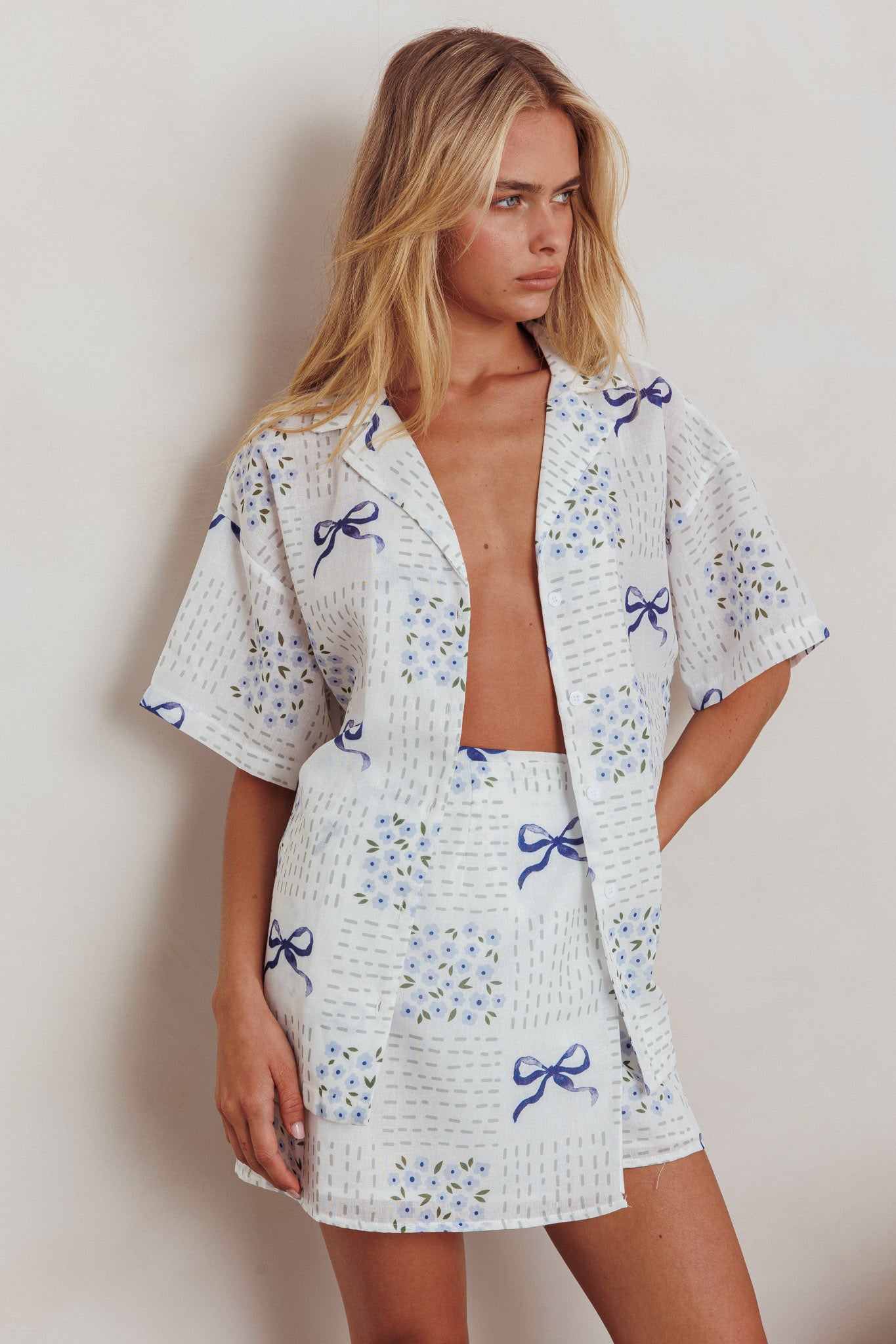 Ithaca Wrap Mini Skirt Bow Print Blue by Selfie Leslie
