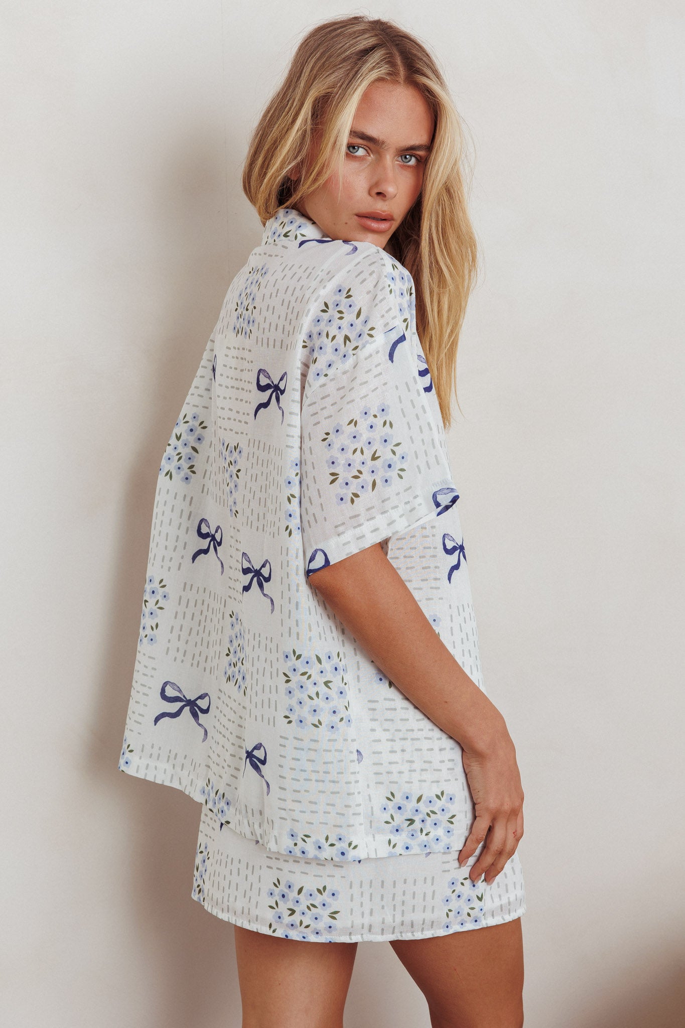Ithaca Wrap Mini Skirt Bow Print Blue by Selfie Leslie