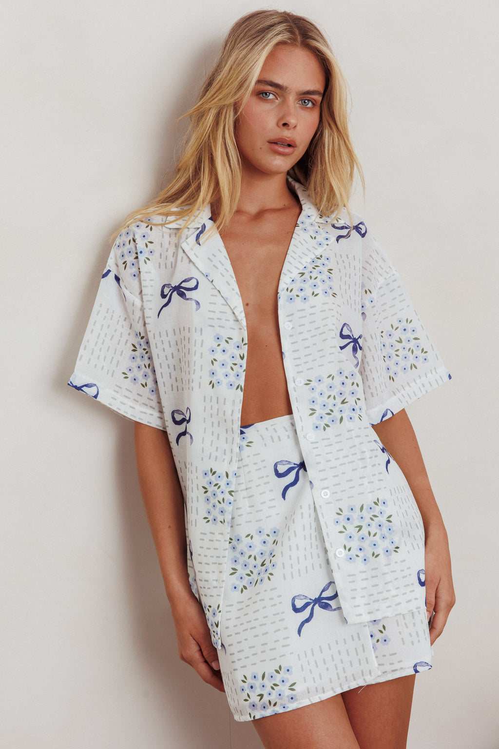 Ithaca Wrap Mini Skirt Bow Print Blue by Selfie Leslie
