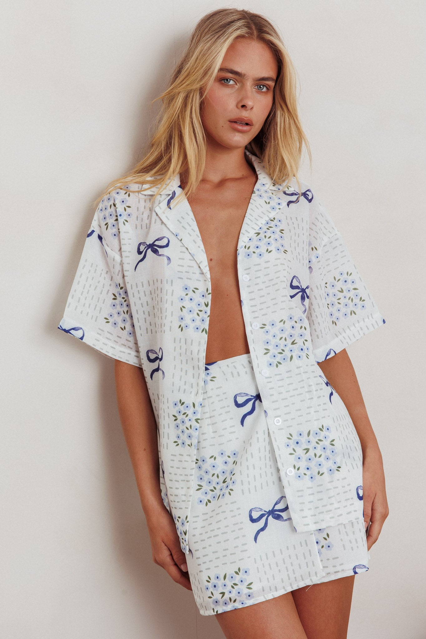 Ithaca Wrap Mini Skirt Bow Print Blue by Selfie Leslie