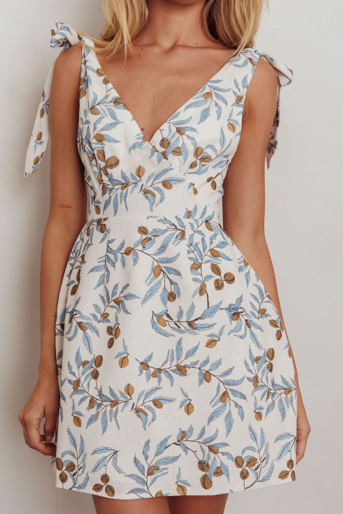 Glam Up Tied Shoulder Mini Dress Leaves Beige by Selfie Leslie