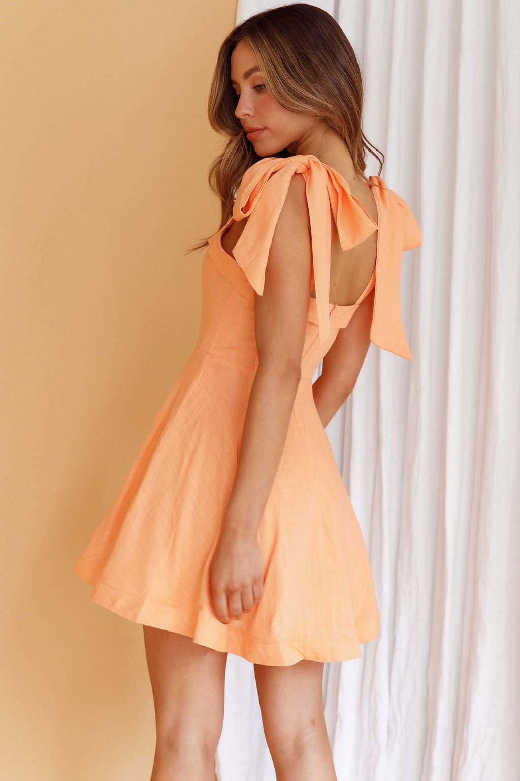 Jeanie Bow Shoulder Mini Dress Orange by Selfie Leslie