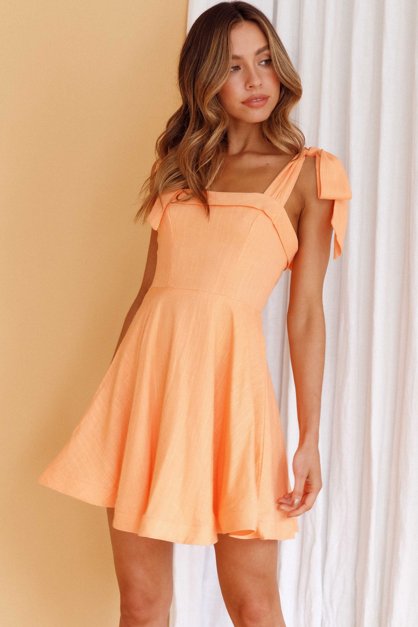 Jeanie Bow Shoulder Mini Dress Orange by Selfie Leslie